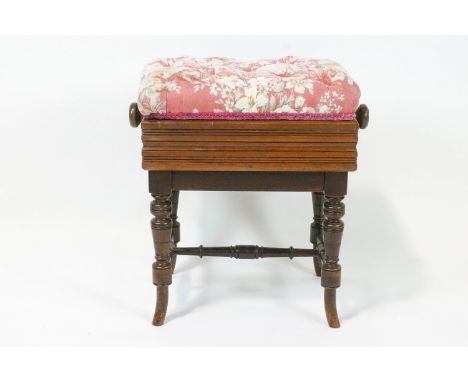 A late Victorian mahogany piano stool, the rectangular button upholstered seat on turned legs linked by H stretchers, 54.5cm 