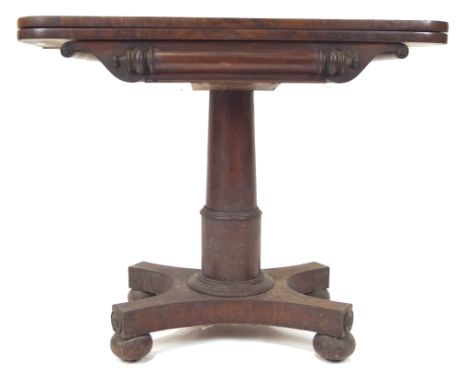 A late 19th century Victorian  mahogany card table having a folding felt top with carved and scrolled detailing, all raised o