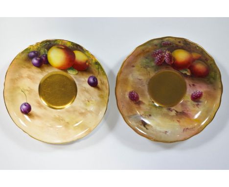 Two Royal Worcester saucers decorated with painted fruit, signed by Ayrton and Moseley, 14.5cm diameter
