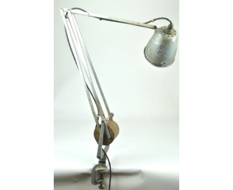 A mixed metal angle poise lamp with counter balance weight and a clamp base by Hardrill &amp; Horstman, 130cm high