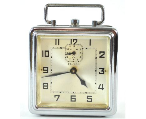 A German (HAC) chrome alarm clock, of squared form with top strap handle, set a silvered Arabic dial, 10.5cm high