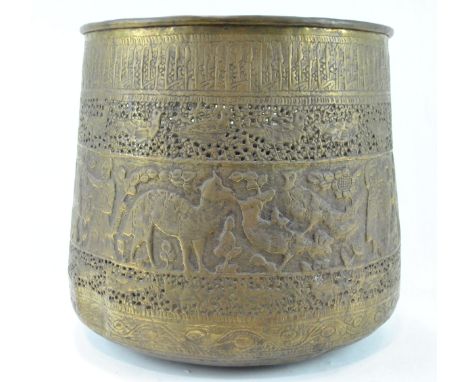 A 19th century brass Persian/Turkish planter, with two pierced bands enclosing embossed animals, birds and figures, 33cm high