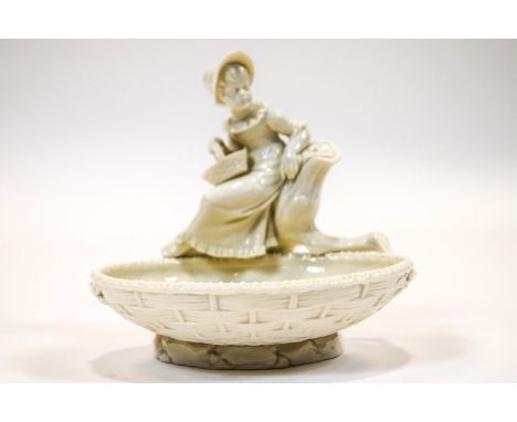 A late 19th century Royal Worcester sweetmeat dish, modelled by James Hadley with a figure in the style of Kate Greenaway, pr