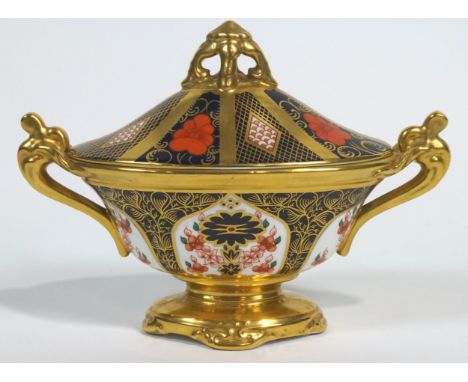 A Royal Crown Derby Imari pattern urn shaped vase and cover, 20th century printed red marks, pattern No 1128, with richly gil