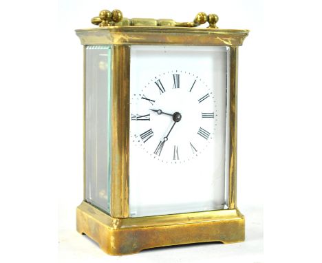 A carriage timepiece, with brass four glass case, enclosing an enamel dial, 14.5cm high