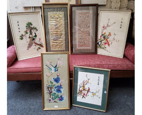 A set of three Chinese textile panels on silk depicting Asiatic Golden Pheasants, Ho-Ho Birds &amp; peacocks, framed;&nbsp; a