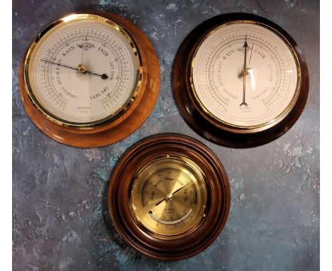Three Russell of Norwich aneroid barometers the largest 20.5cms dia, NOS original packaging;&nbsp;&nbsp;A circular brass baro