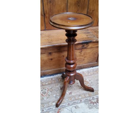 A mahogany torchere, circular top, turned column, tripod legs, 75cm high, 19th century in parts 