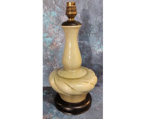 A Korean celedon side light, ebonised base, 34cm high 