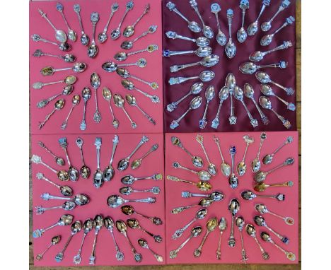 A collection of spoons including sterling silver and enamel examples, arranged on four trays, mainly Yorkshire &amp; American