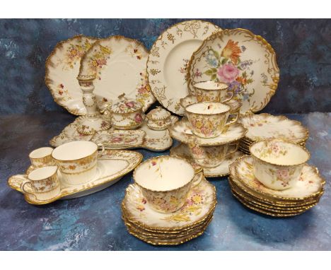 A Wedgwood pattern no.Z2603 shaped tea/biscuit saucer, teacup, miniature milk jug &amp; sugar bowl; a GD &amp; Cie, Limoges d