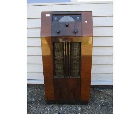 A Pye model 812 walnut cased floor standing radio with Bakelite knobs, Army and Navy Stores label to back  