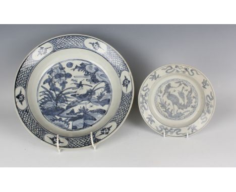 A Chinese Swatow blue and white porcelain circular dish, Ming dynasty, probably Wanli period, painted with a central bird pan