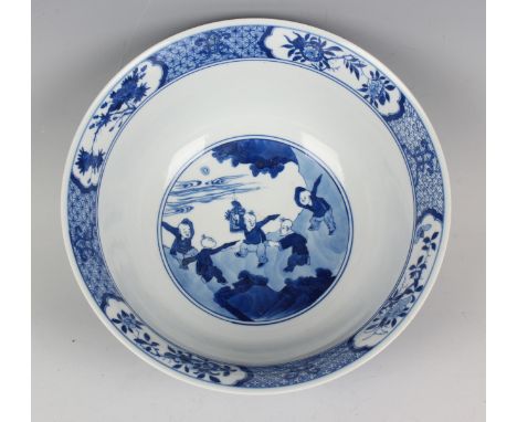 A Chinese blue and white porcelain bowl, Kangxi style but modern, painted with figural panels, underglaze blue pseudo six-cha