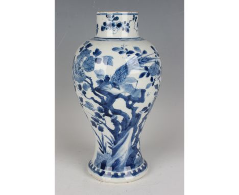 A Chinese blue and white porcelain vase, Kangxi period, of baluster form, painted with a bird perched amidst peony, unmarked,