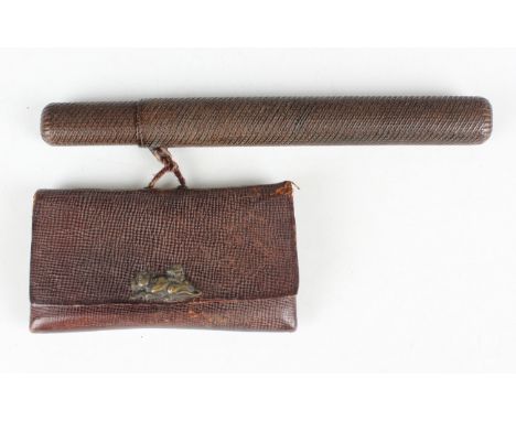 A Japanese wood kiseruzutsu (pipe case), Meiji period, of oval section, carved in low relief with diagonal bands, length 22.8