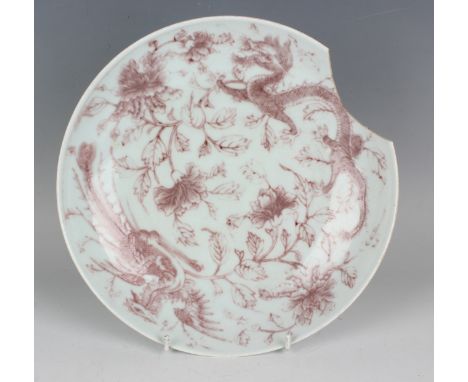 A Chinese underglaze red porcelain saucer dish, mark of Daoguang but 20th century, the interior painted with dragon, fenghuan