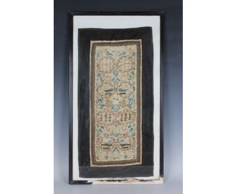 A Chinese silk embroidered rectangular panel, late Qing dynasty, worked in coloured and gilt wire threads with lines of text 