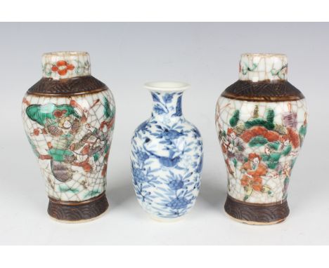 A Chinese blue and white porcelain vase, mark of Kangxi but late 19th century, painted with birds amidst flowers, underglaze 