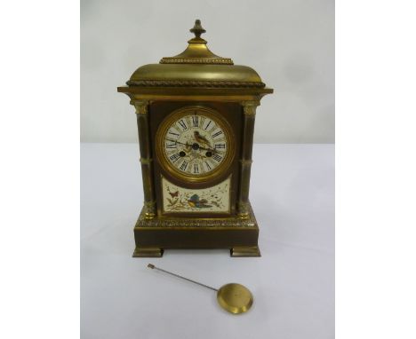 A late Victorian brass mantle clock with applied enamel plaques in the aesthetic style to include pendulum