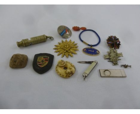 A quantity of collectables to include a Metropolitan Police whistle, a cigar cutter and a netsuke