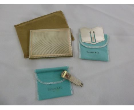 A Tiffany white metal cigar cutter, money clip and cigarette case all in original pouches