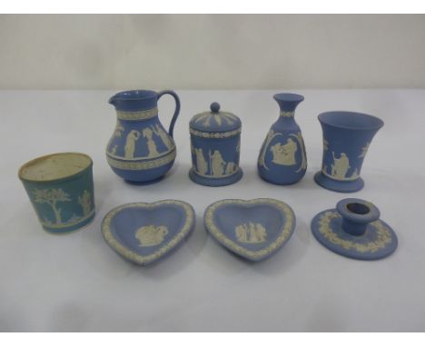 A quantity of Wedgwood blue Jasperware to include jugs, vases and a chamber stick (8)