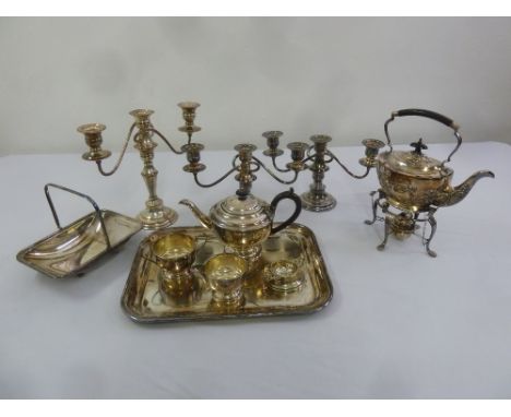 A quantity of silver plate to include candelabra, a tray, a teaset, kettle on stand and a dish