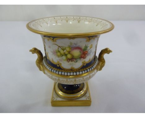 A Royal Worcester Campagna vase painted with fruit and leaves with birds heads side handles, gilt decorations and pearl beadi