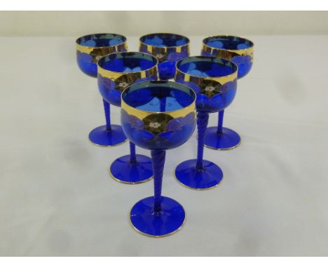 A set of six Venetian long stem blue and gilt wine glasses