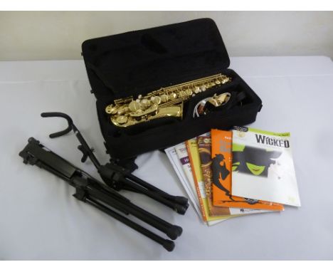 An Artemis A1 brass saxophone in fitted case, to include tripod stand, music stand and sheet music