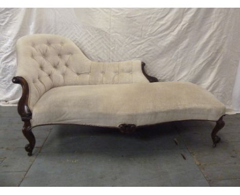 A Victorian mahogany chaise longue with scroll upholstered button back on four scroll legs