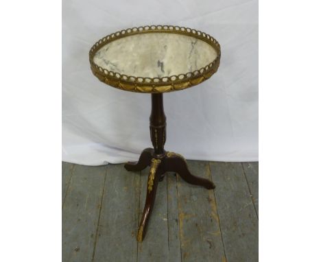 A circular mahogany and marble occasional table with gilt metal gallery on tripod base