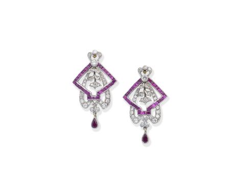 Pair of ruby and diamond earringsOf geometric openwork design with foliate detail, set with calibré-cut rubies, single and br