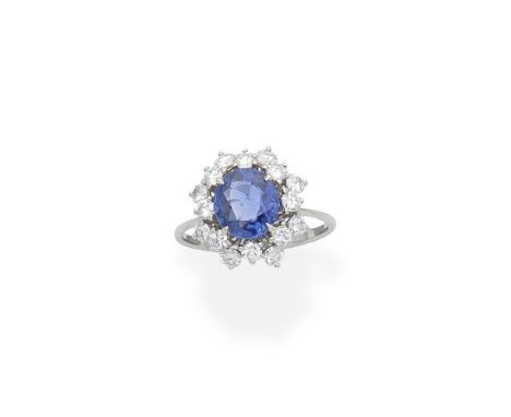 Sapphire and diamond cluster ringSet with an oval-cut sapphire and brilliant-cut diamonds, ring size approx. R½Footnotes:Acco