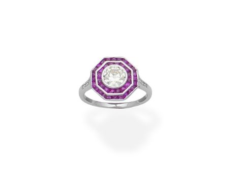 Ruby and diamond target ringSet with a brilliant-cut diamond within octagonal borders of French-cut rubies, the shoulders set