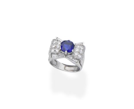 Sapphire and diamond dress ring, circa 1935The cushion-shaped sapphire between tiered shoulders set with baguette, brilliant 