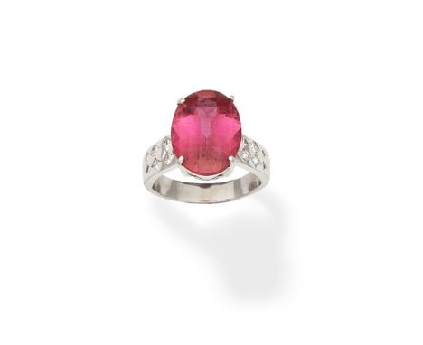 Pink tourmaline and diamond ringThe oval fancy-cut tourmaline between princess-cut diamond shoulders, ring size very approx. 