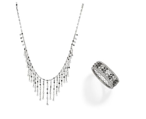 Diamond and black diamond bangle and necklace1st: Of latticework design, set with brilliant-cut diamonds and circular-cut tre