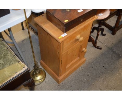 A stripped pine bedside cabinet; together with a brass standard lamp