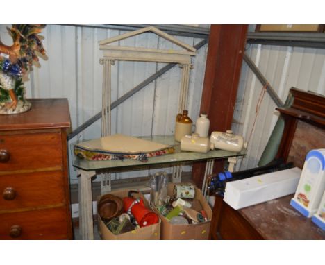 A metal framed and glass topped console table with matching mirror frame