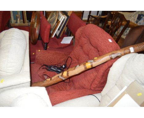 An upholstered button back electrical reclining armchair