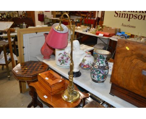 A brass reading lamp
