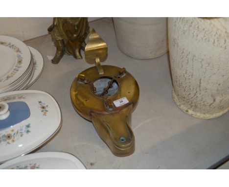 An ornate brass temple lamp