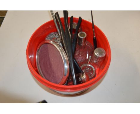 A box containing silver topped dressing table jars; a silver bangle; two pairs of gloves stretchers; a silver photo frame etc