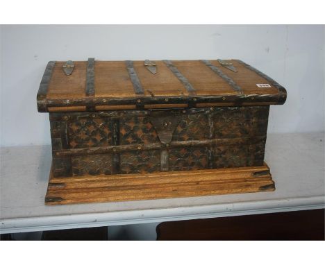 Teak trunk with metal strapping