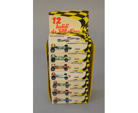 7 x Polistil 1:32 scale boxed F1 racing cars with trade carton. Brabham BT/26, McLaren M7A, BRM, Honda, Lotus Climax, Ferrari