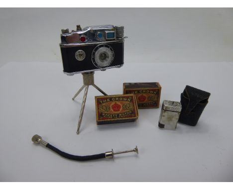 A Phenix Camera Lighter together with a miniature vintage Camel lighter and matches.