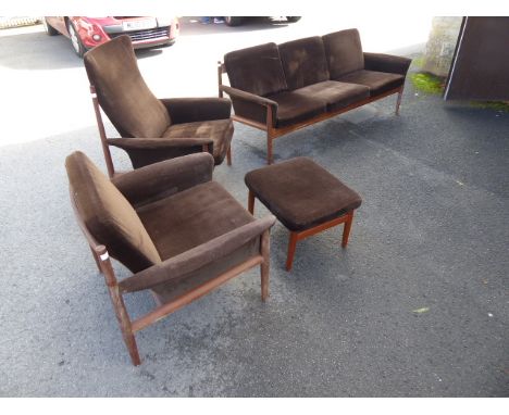 A 20th Century Retro Danish Designer Teak Three Seater Sofa, with two easy chairs one high back and one low back together wit