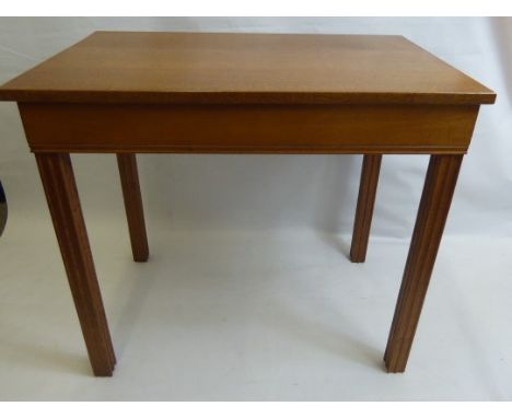 A Gordon Russell Oak Side Table, of simple design on fluted block legs, approx 84 x 53 x 75 cms, copper Gordon Russell label.